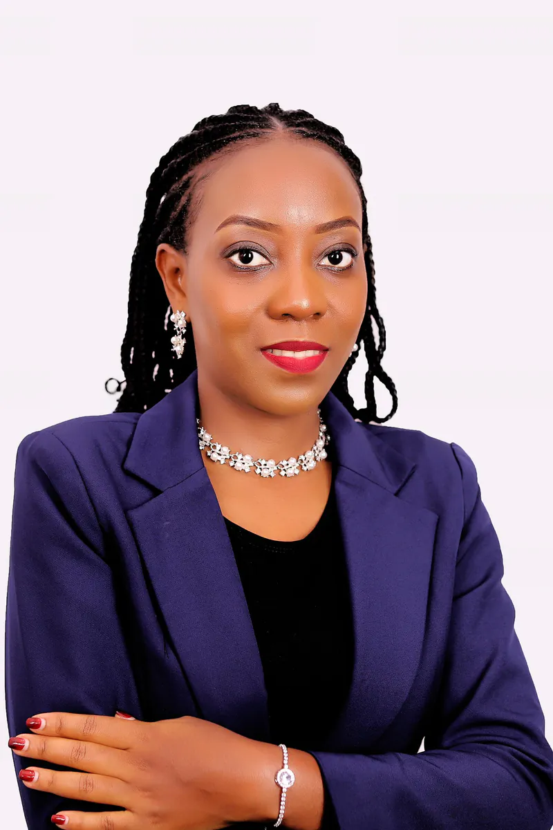 Portrait of Peninah Joy Kansiime in a navy blazer